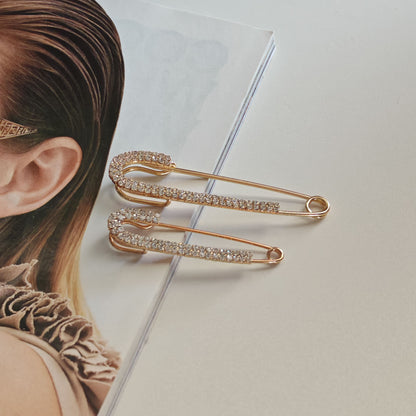 Set de ace de siguranță în două dimensiuni, decorate cu cristale – look chic și rafinat.