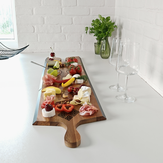 charcuterie board set for party with cheese and fruit arrangement