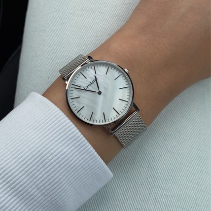 Elegant watch with mesh strap and natural mother-of-pearl dial